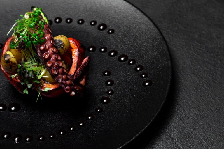 Sea delicacy grilled octopus with grilled vegetables.